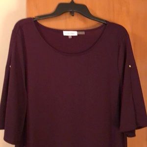 Never worn Calvin Klein split sleeve top